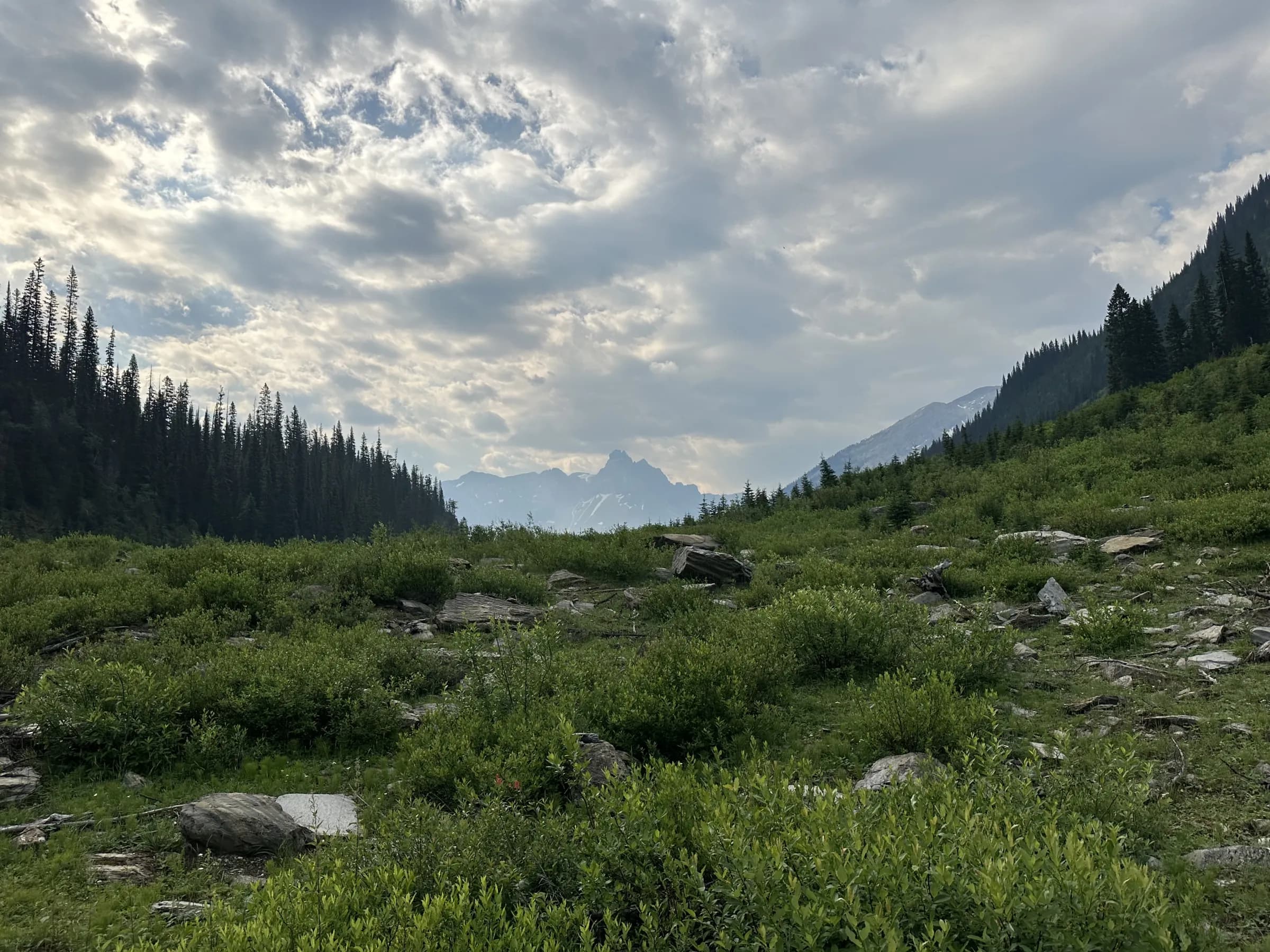 Mountain valley beneath an open sky