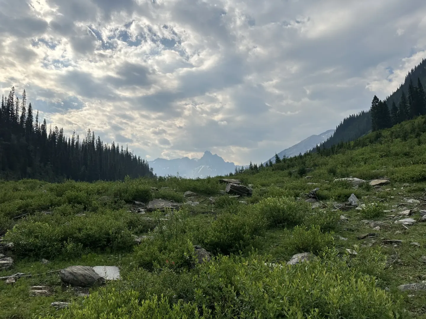 Mountain valley beneath an open sky